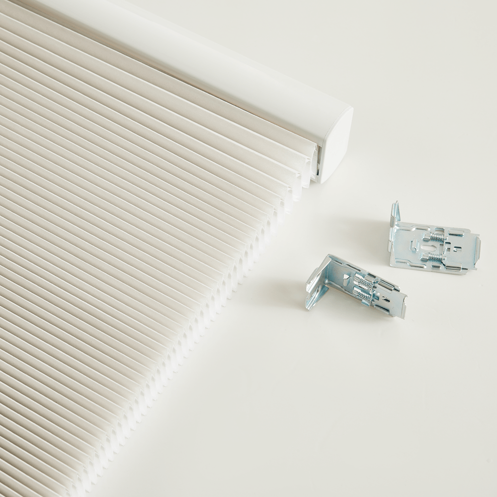 Dual-core cellular shades with honeycomb design for effective insulation and soundproofing, enhancing home comfort.